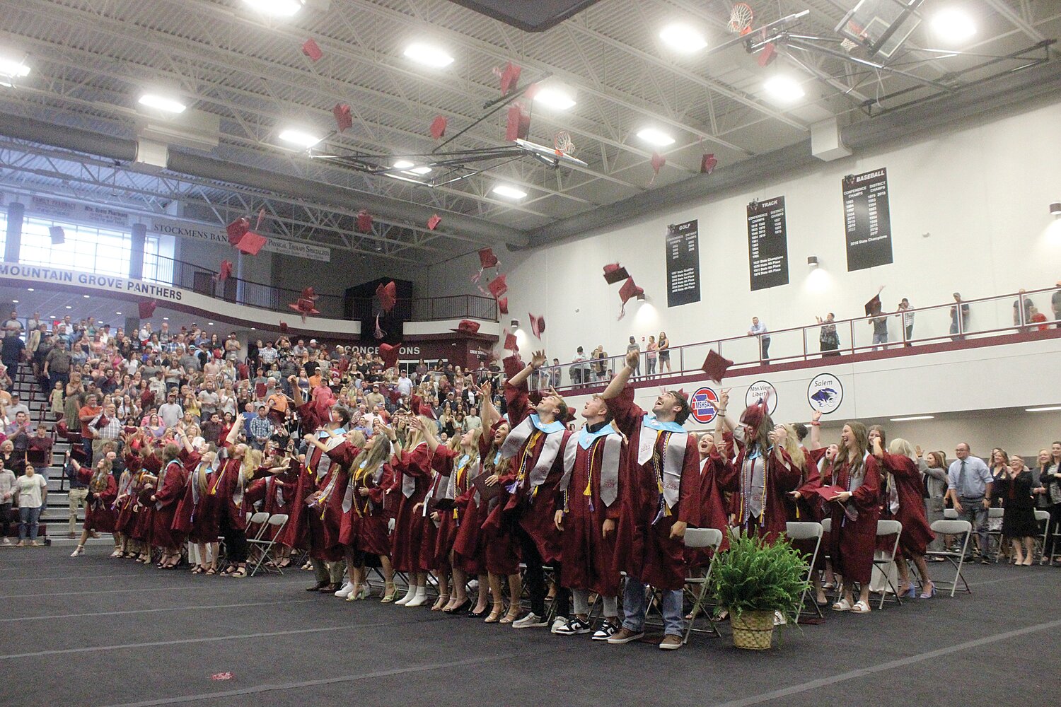 Mountain Grove’s Class of 2023 throw their graduation caps into the air during Commencement held on Friday, May 12 inside the Arena.